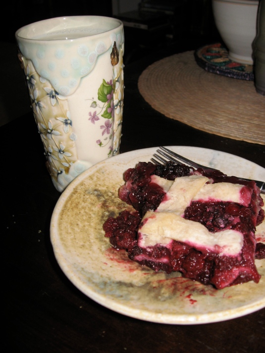 Another spring treasure I'm waiting patiently for, local dewberries in a home-made cobbler. Cup by Liz Smith, plate by me.